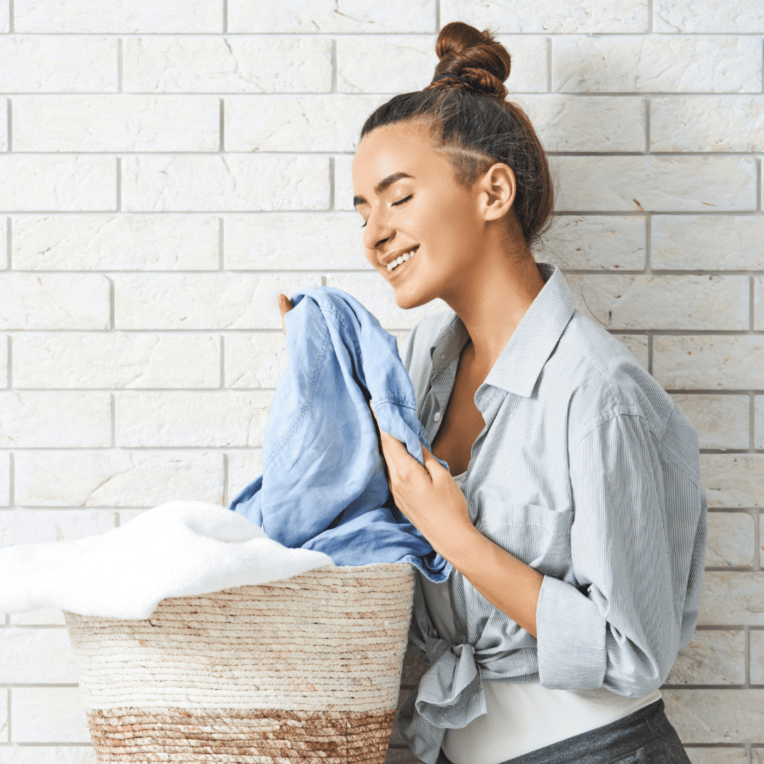 Female Smelling Clean Laundry